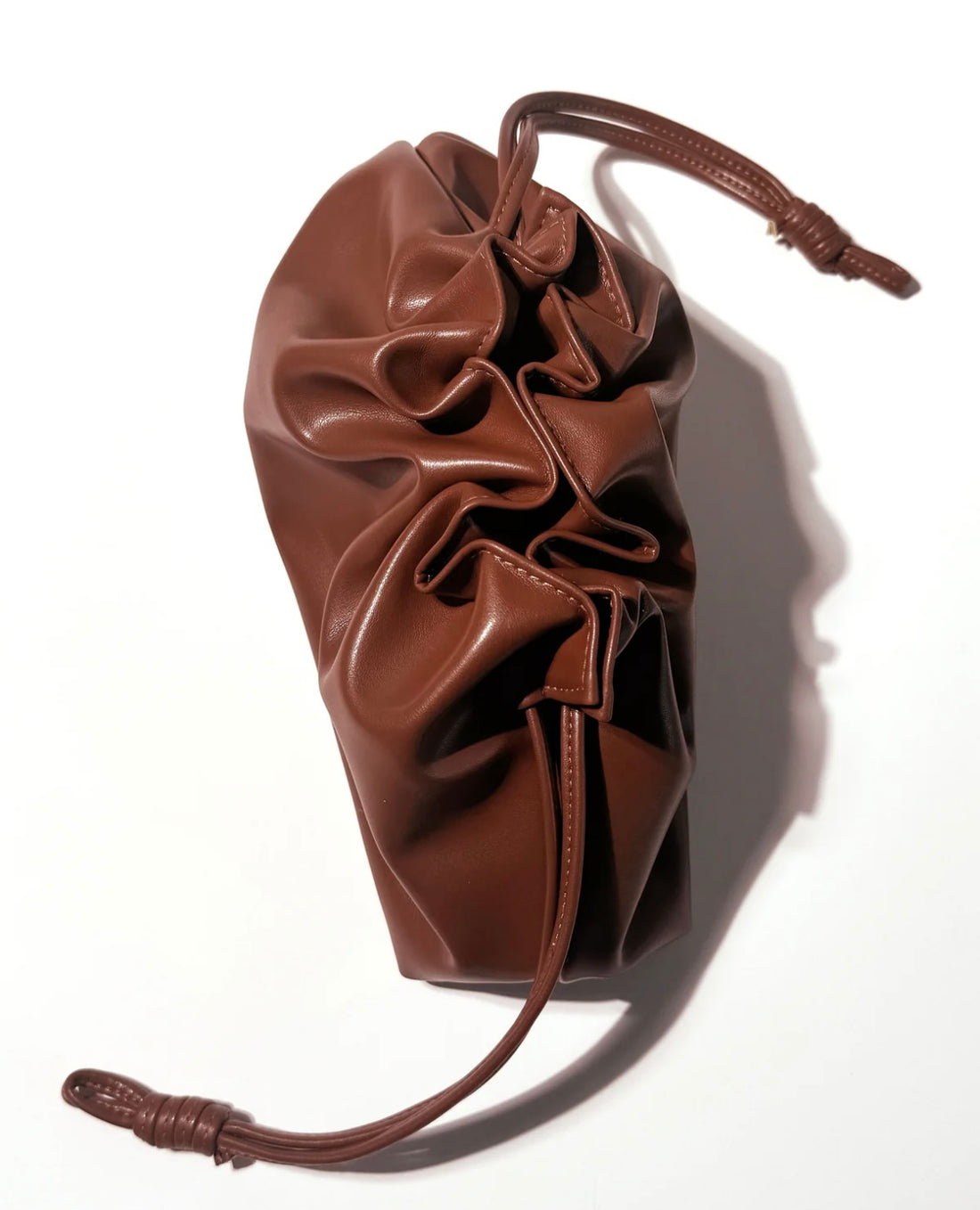 Patrick Ta     
The Elevated Beauty Bag In Brown 🤎