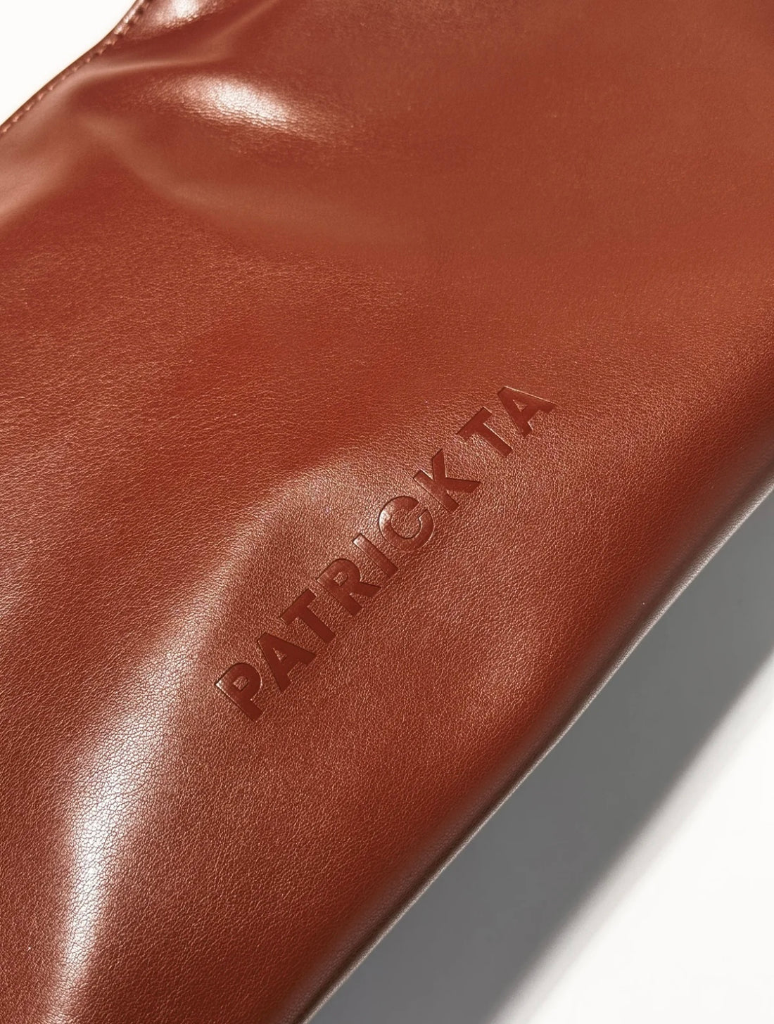 Patrick Ta     
The Elevated Beauty Bag In Brown 🤎