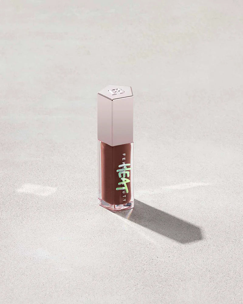 Fenty Beauty   
Gloss Bomb Heat Universal Lip Luminizer + Plumper -   
Hot Chocolit Heat — sheer rich brown