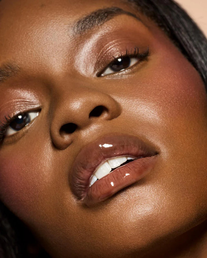 Fenty Beauty   
Gloss Bomb Heat Universal Lip Luminizer + Plumper -   
Hot Chocolit Heat — sheer rich brown