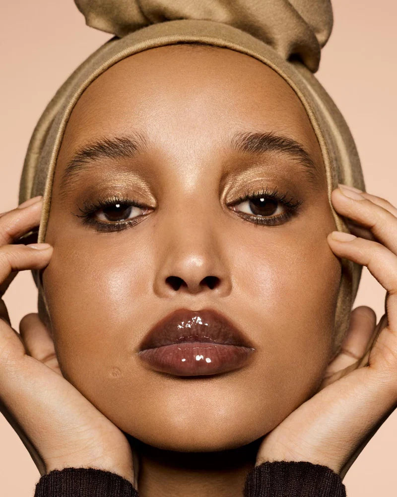 Fenty Beauty   
Gloss Bomb Heat Universal Lip Luminizer + Plumper -   
Hot Chocolit Heat — sheer rich brown