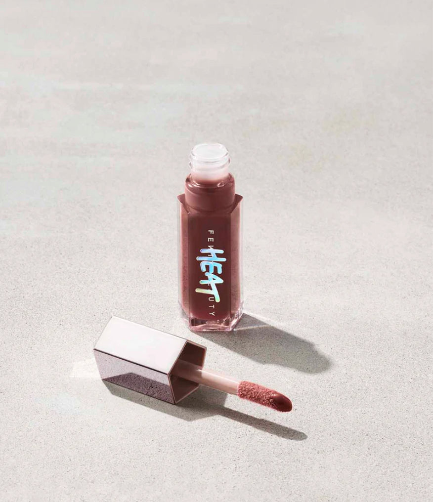 Fenty Beauty   
Gloss Bomb Heat Universal Lip Luminizer + Plumper -   
Hot Chocolit Heat — sheer rich brown