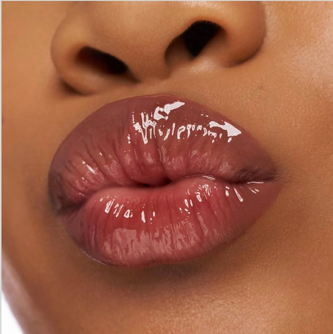 Essence       
CHOCO BOMB Shiny Lip Gloss 🤎