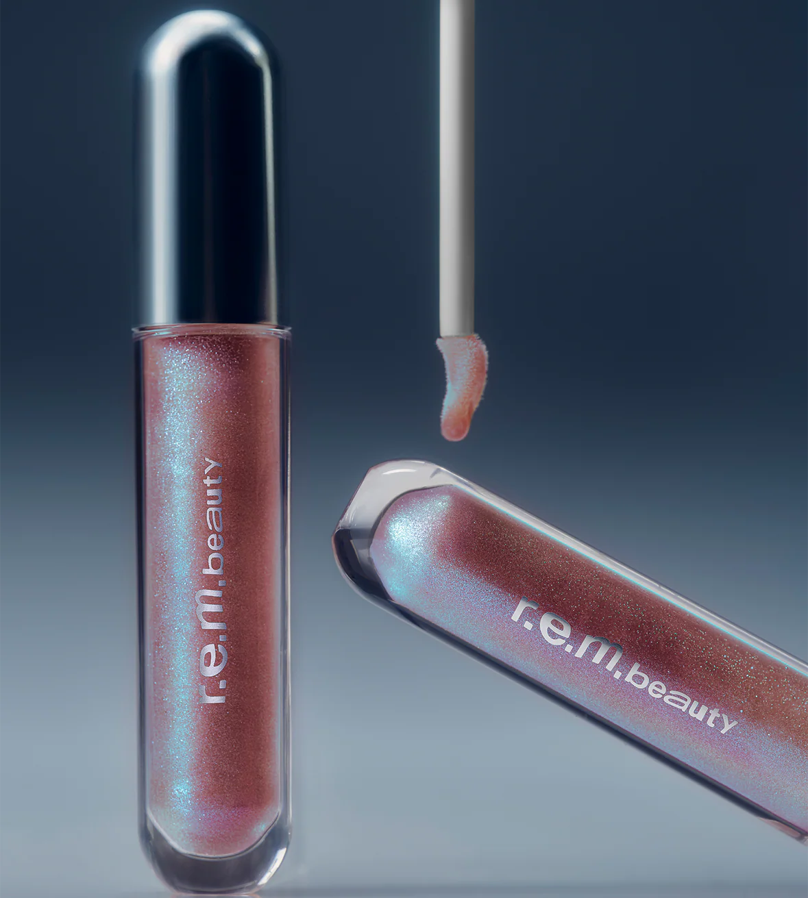 r.e.m.beauty 
essential drip glossy balm - Fembot 🩷