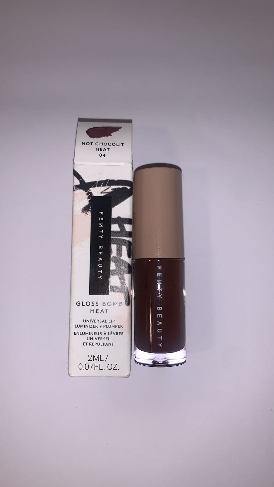 Fenty Beauty by Rihanna  
Gloss Bomb Heat Universal Lip Luminizer + Plumper - Hot chocolit without box 🩷
