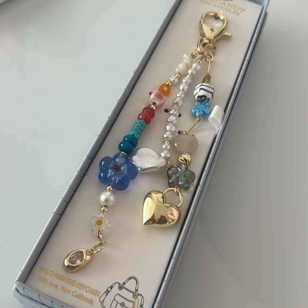 Eye Candy   
Gold, Blue & Pink Beaded Heart Key Bag Charm 💙