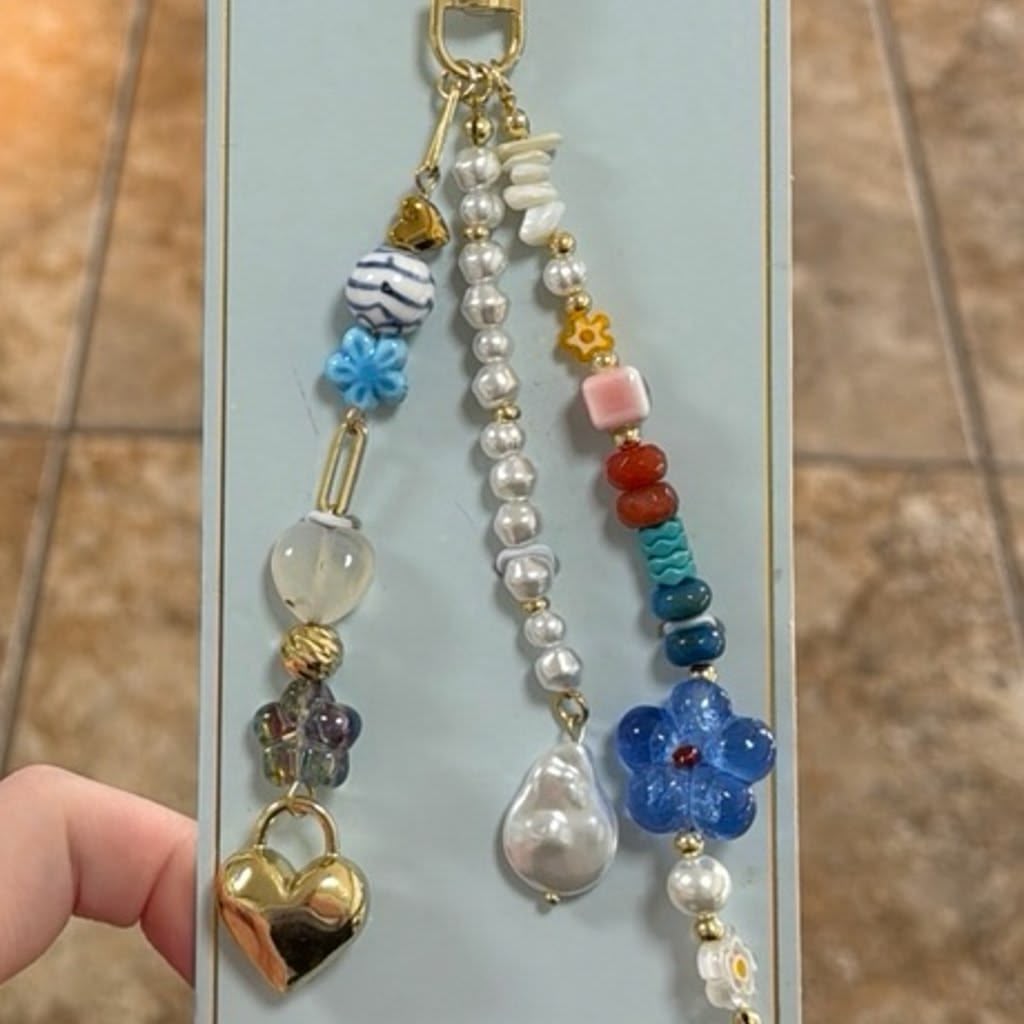 Eye Candy   
Gold, Blue & Pink Beaded Heart Key Bag Charm 💙