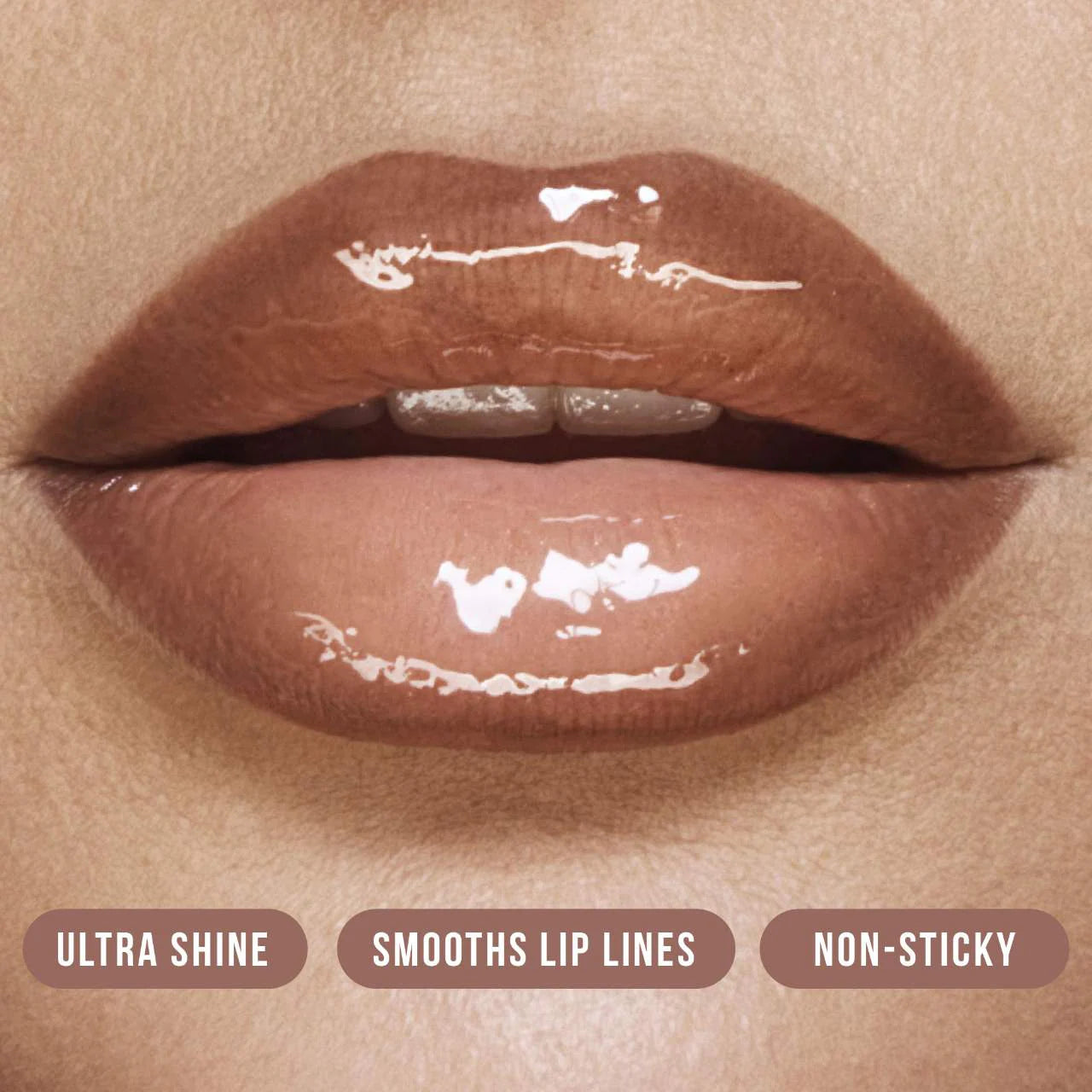 HUDA BEAUTY       
Faux Filler Shiny Non-Sticky Lip Gloss - Bombshell 🤎