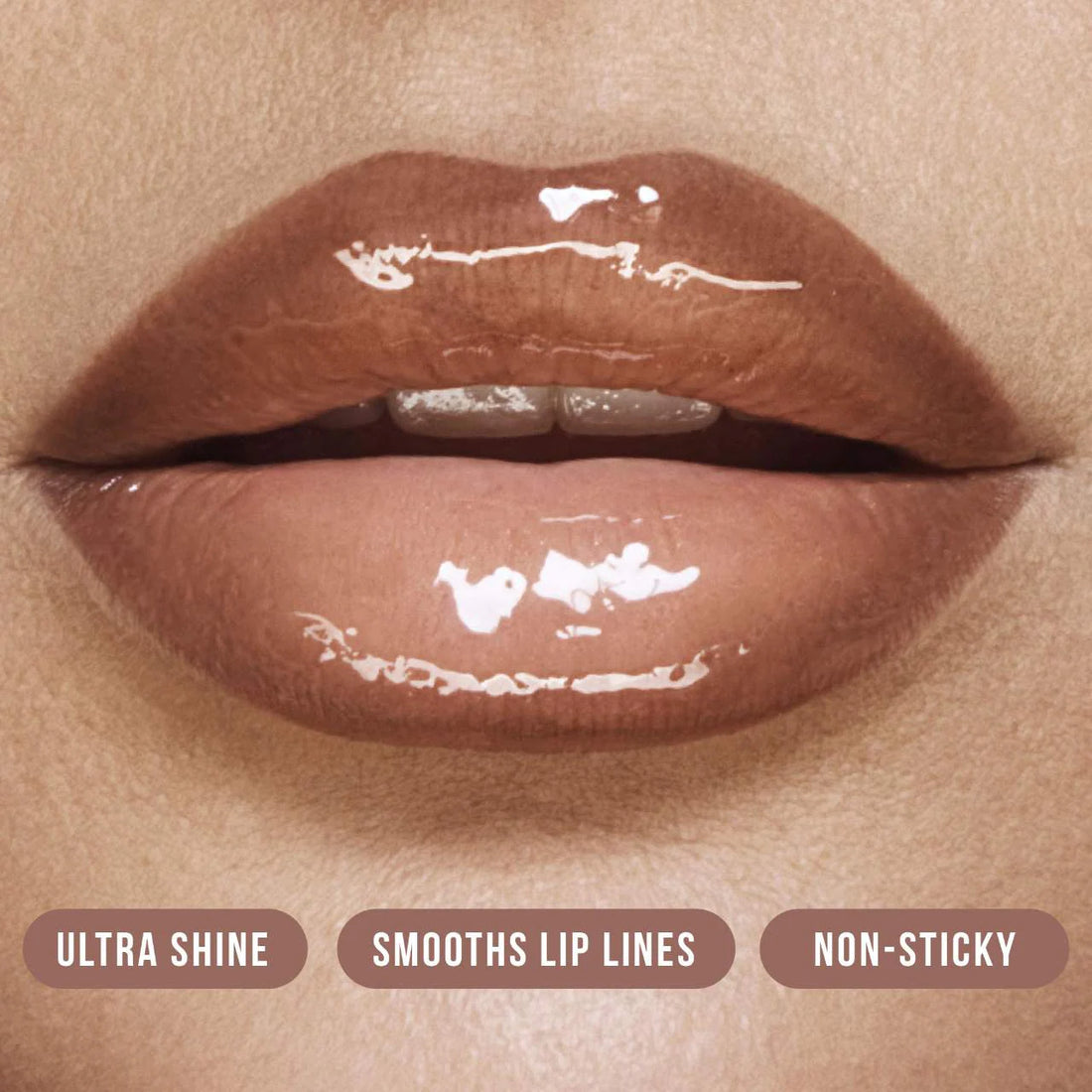 HUDA BEAUTY       
Faux Filler Shiny Non-Sticky Lip Gloss - Bombshell 🤎